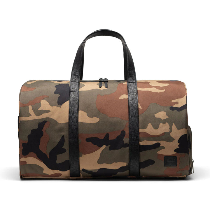 Herschel - Herschel Novel™ Duffle in Woodland Camo Black Label
