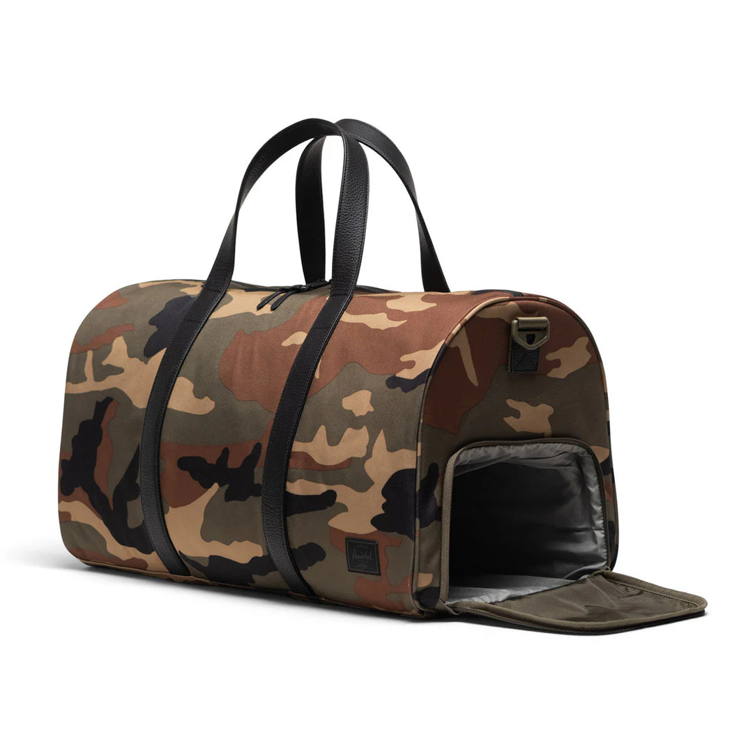 Herschel - Herschel Novel™ Duffle in Woodland Camo Black Label