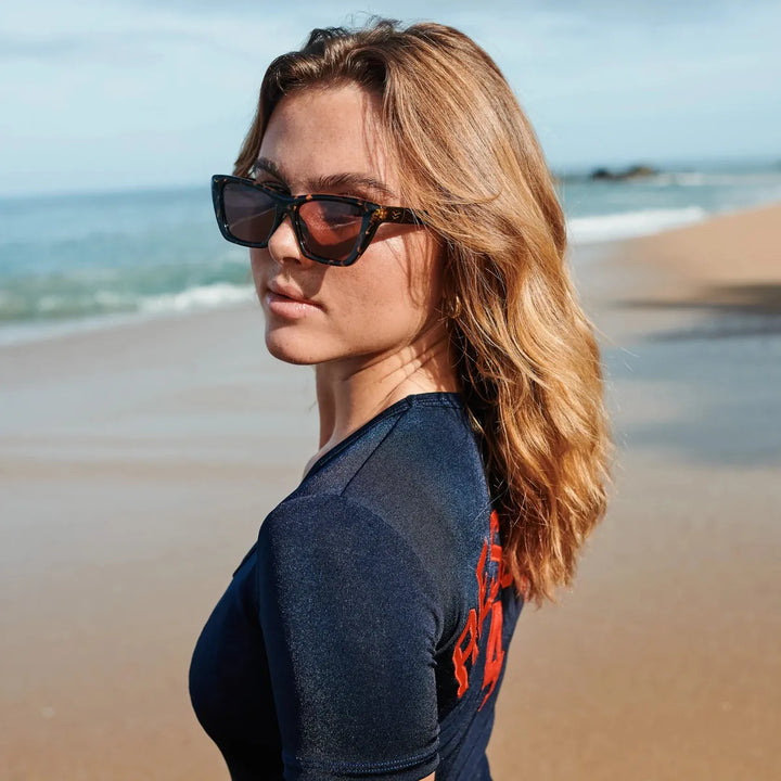 Cate with Tortoise Frames and Plum Polarized Lenses